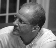 Grayscale portrait photo of Charles Marcus