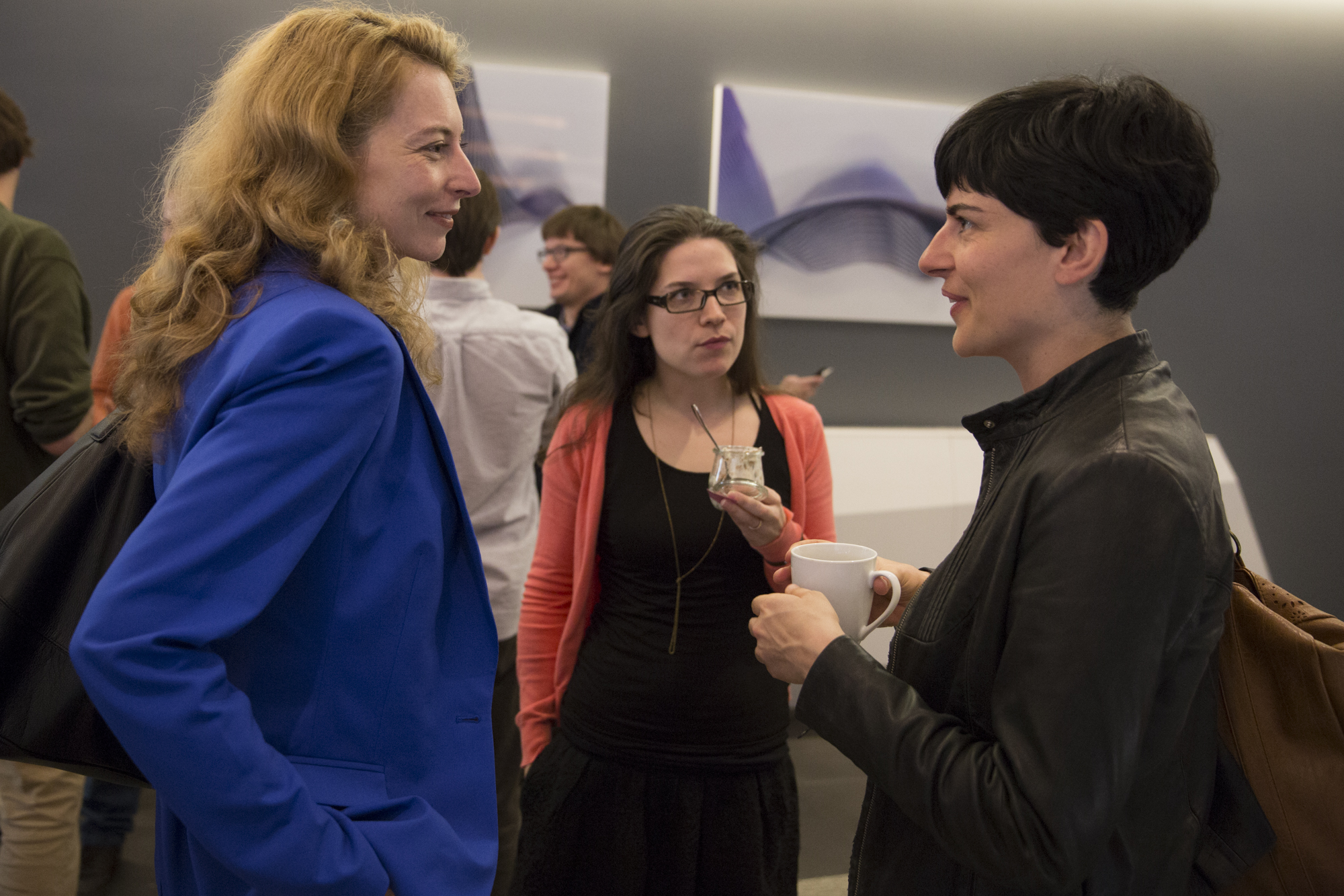 Three women standing and talking