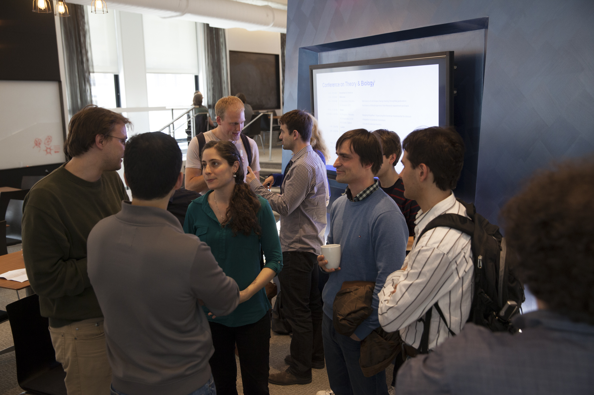 Group of people standing and talking