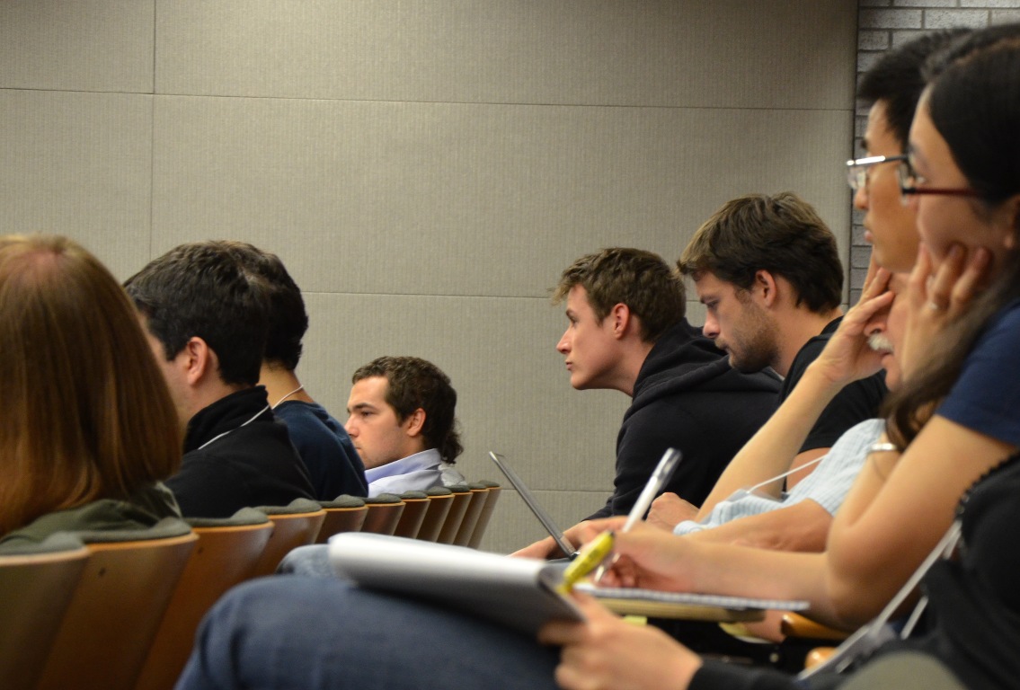 Two rows of people in a lecture hall