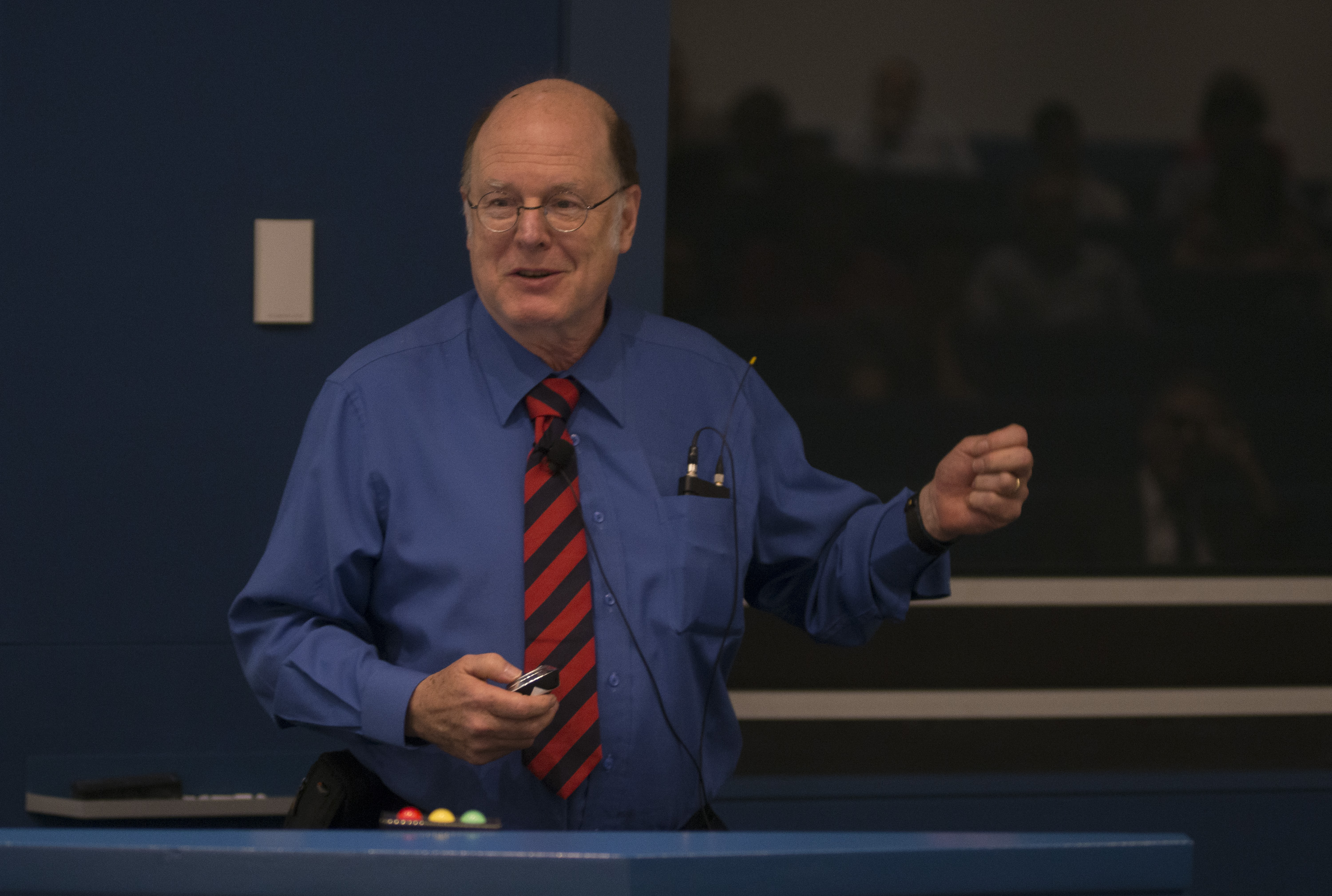 Man standing behind a lectern