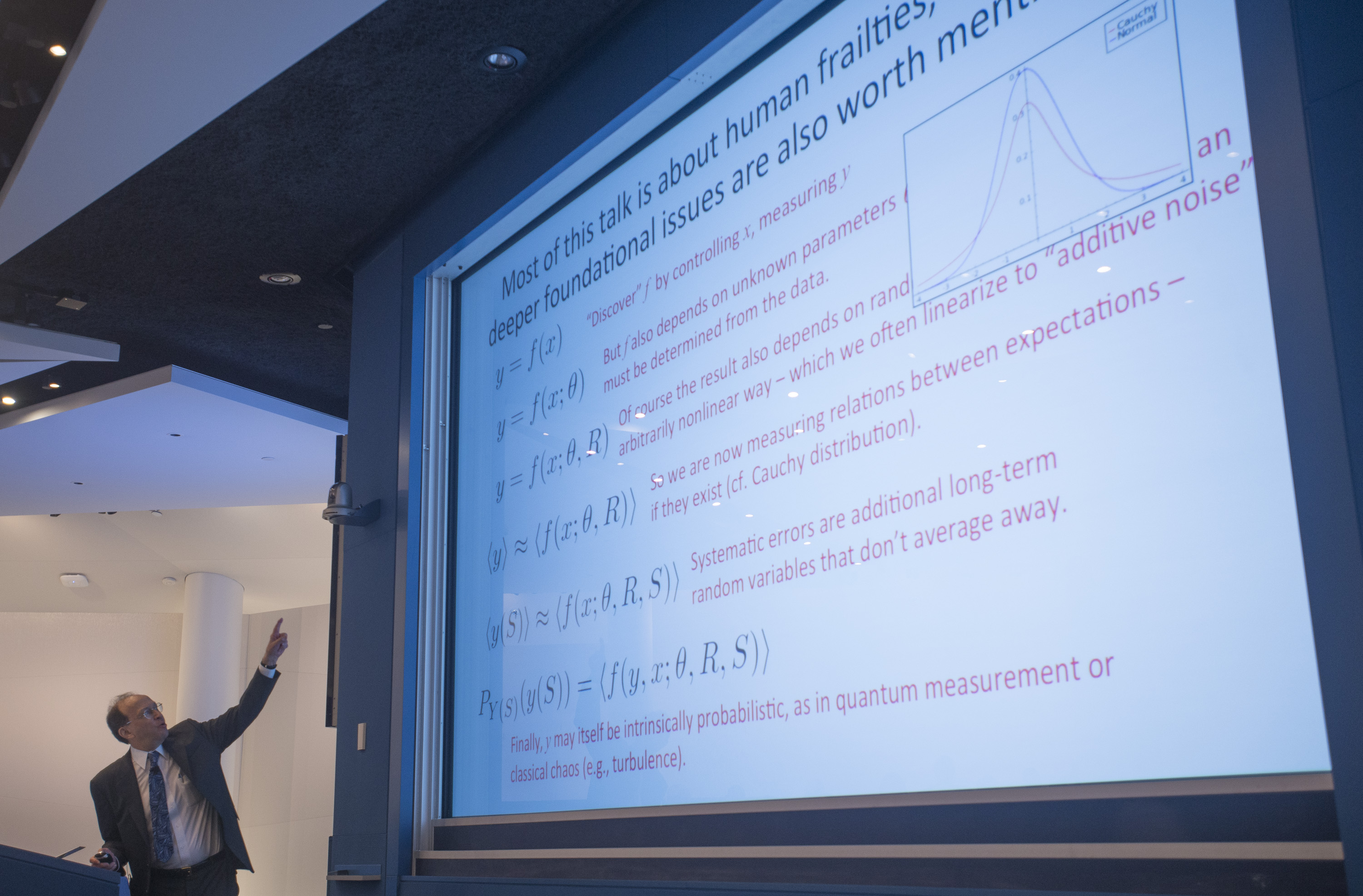 Man presenting a slideshow that's titled: 