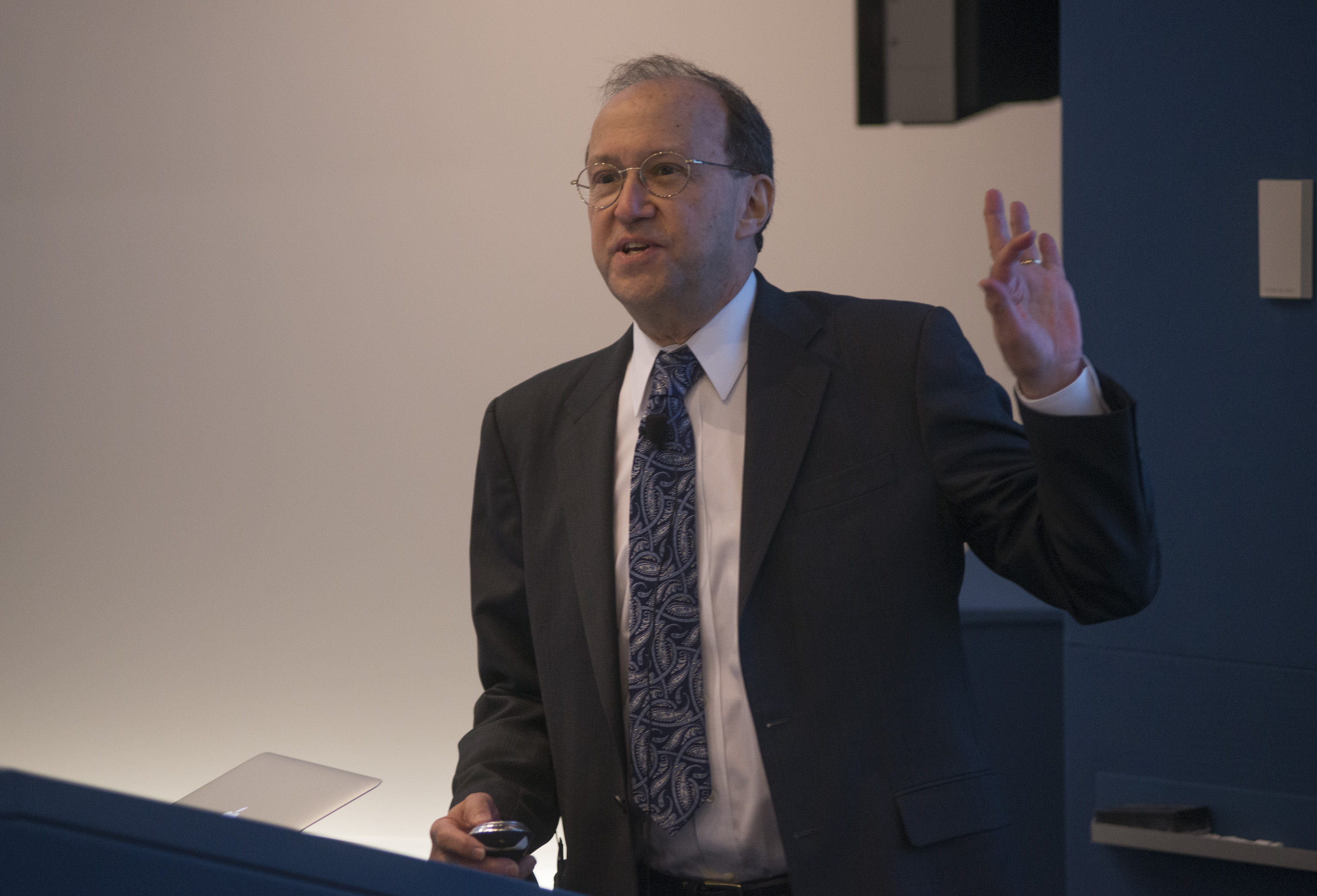 Man standing behind a lectern