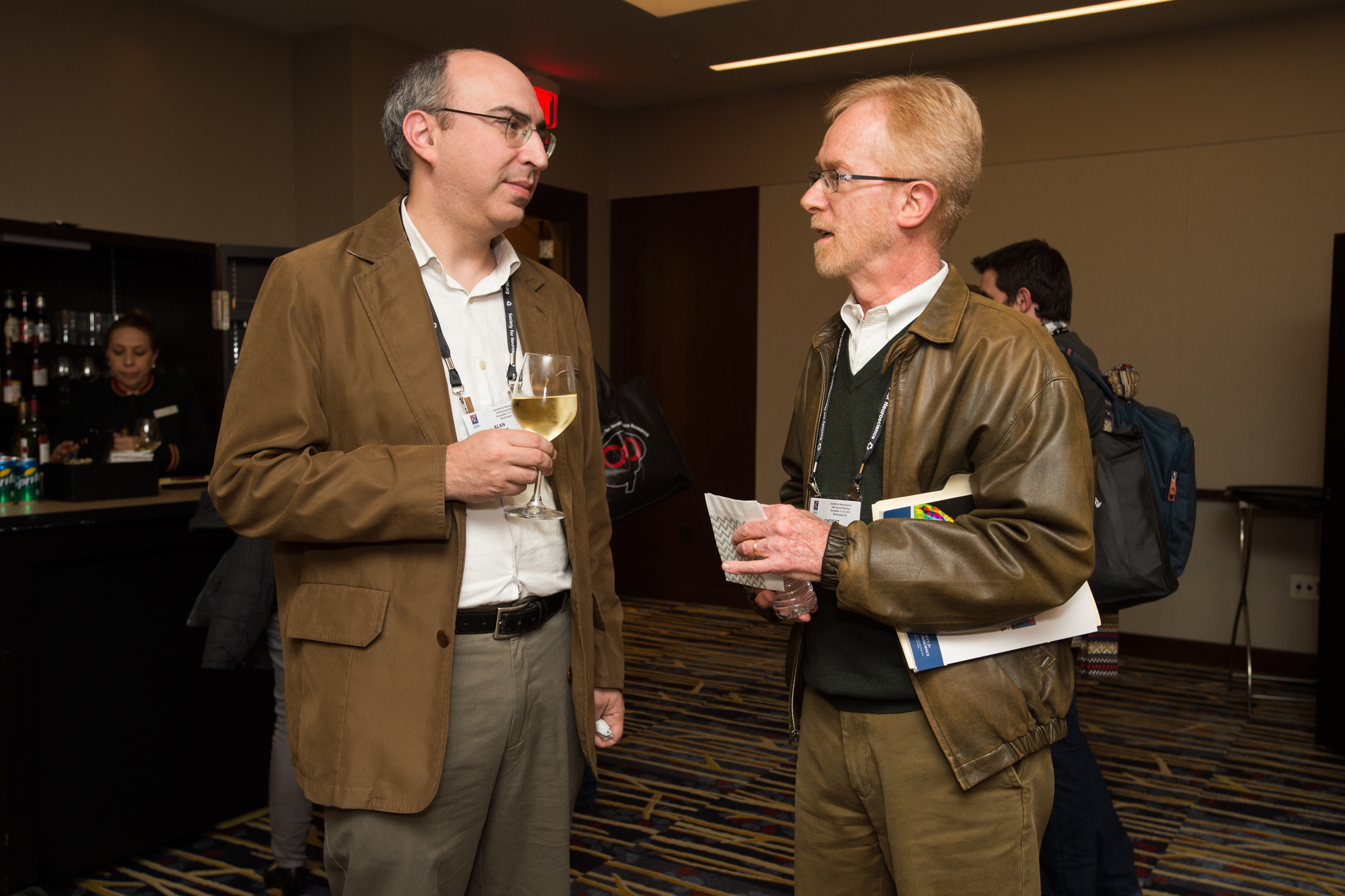 Two men standing and talking