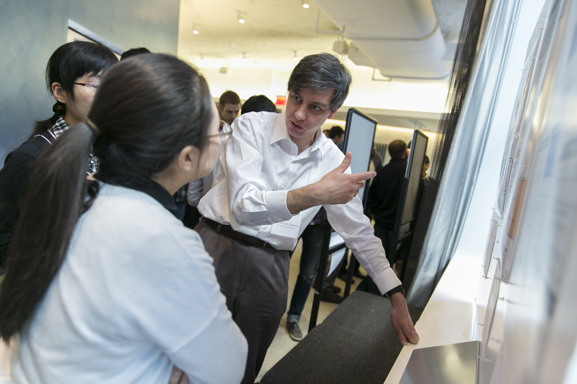 Two people looking at a presentation