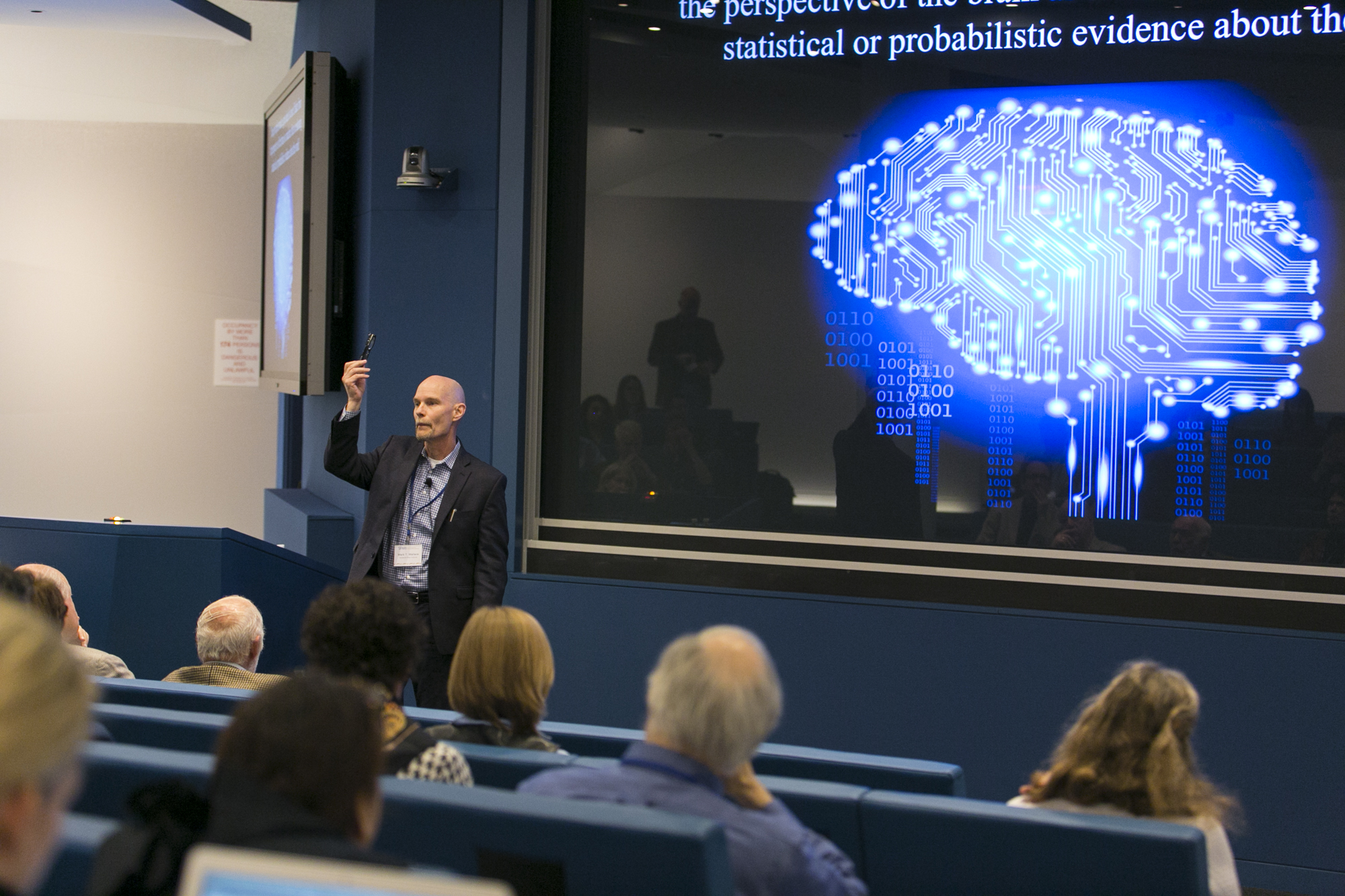 Man standing in front of a lecture hall
