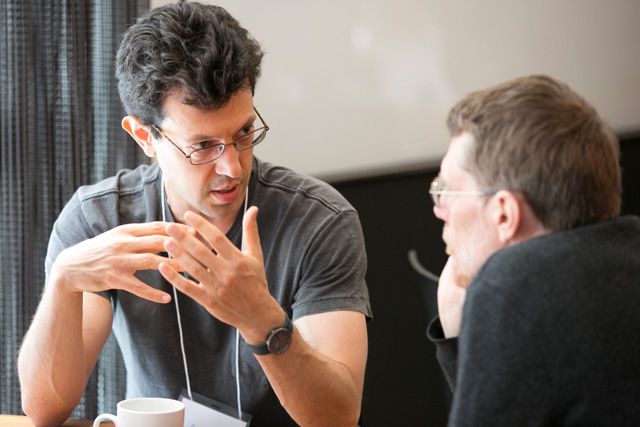Two men sitting at a table together