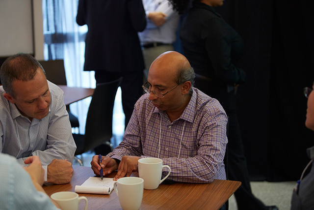 Senthil Todadri and Leo Radzihovsky sitting at a table together