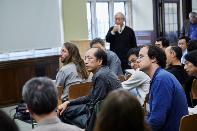 People sitting in a lecture hall looking to the left