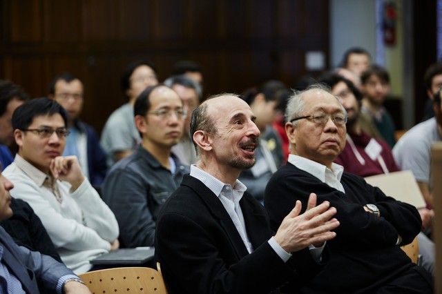Man sitting and talking while gesticulating with his hands