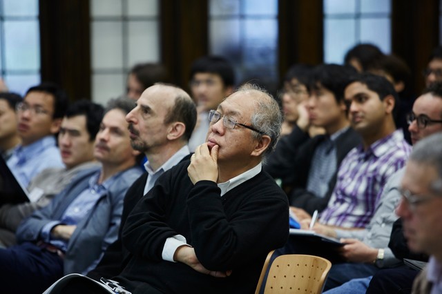 Lecture hall full of people sitting and looking forward