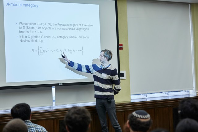Man presenting a slideshow titled A-model category