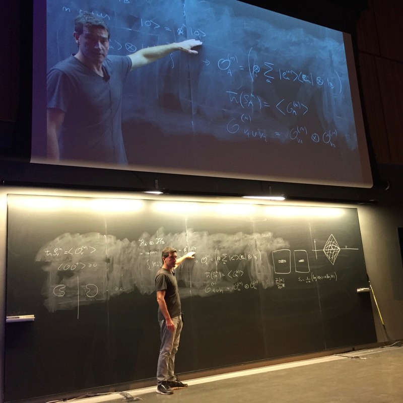 Man standing and pointing to math on a chalkboard