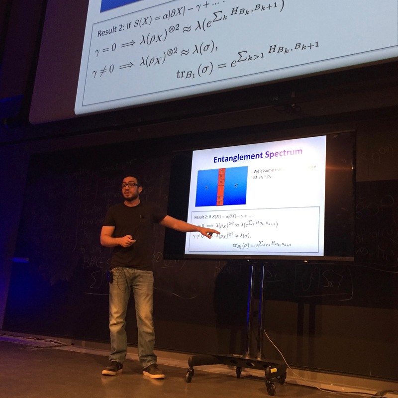 Man pointing to a slide that says 