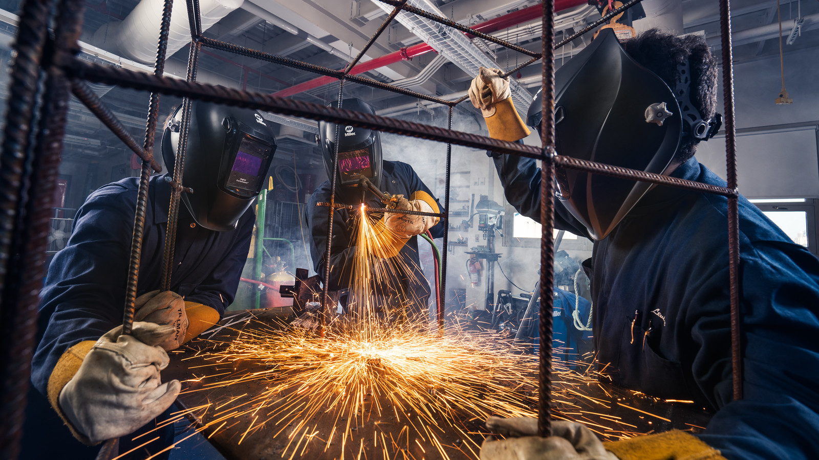 People weld oyster cages for the Billion Oyster Project