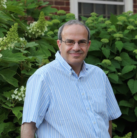Nathan Seiberg in front of plants