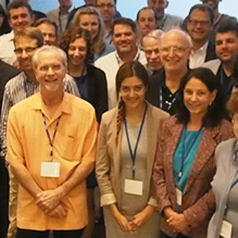 More than 20 people standing and posing for a picture