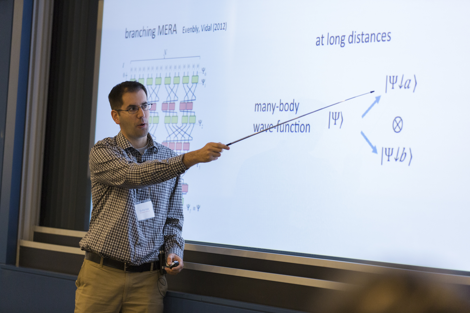 Man pointing to a projected slideshow
