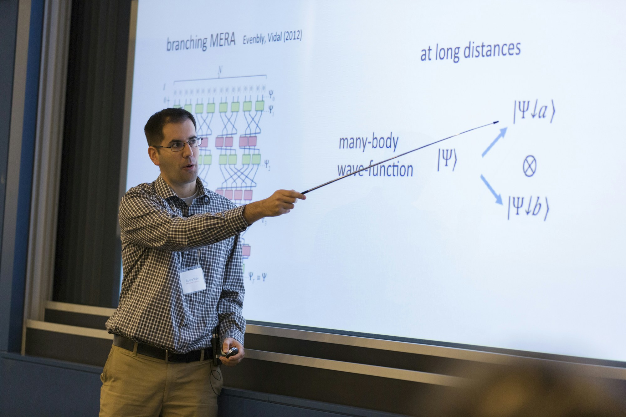 Man pointing to a projected slideshow