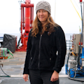 Laurie Juranek in front of a lot of water machinery