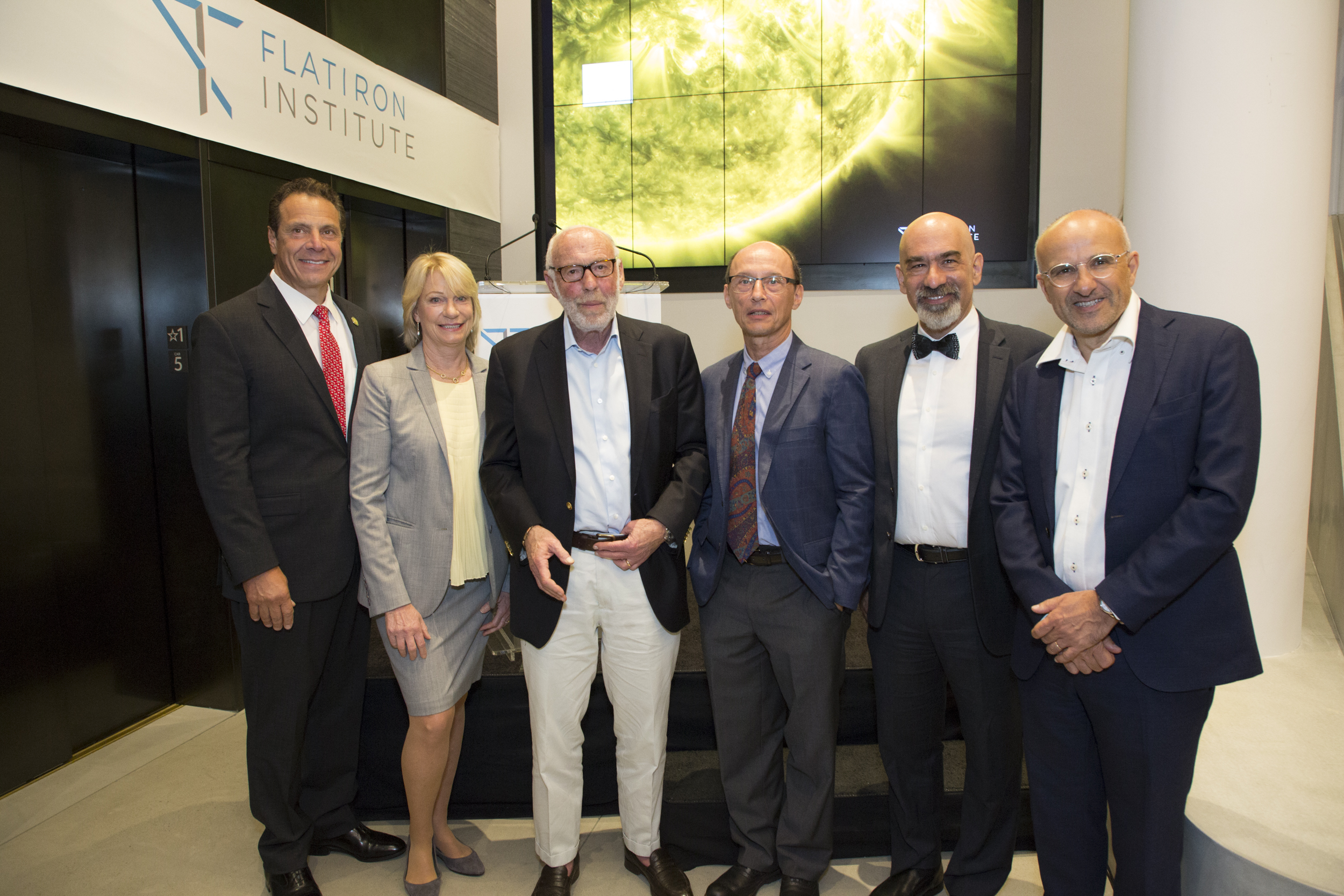 (From left) Gov. Andrew Cuomo, Marilyn Simons, Jim Simons, Dr. Leslie Greengard, David Spergel and Antoine Georges following the ribbon-cutting ceremony at the Flatiron Institute dedication