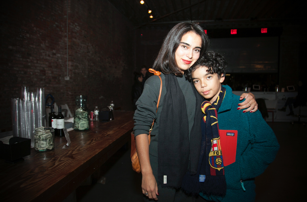 Woman putting an arm around a boy