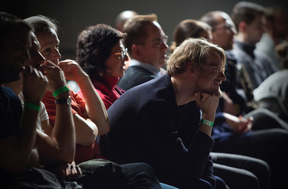 Row of people sitting and looking forward