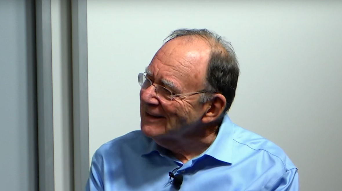 Dick Karp looking to the left while smiling