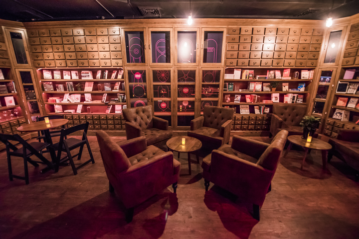 Vintage armchairs add to the speak-easy feeling at Caveat, a new event space on the Lower East Side of Manhattan