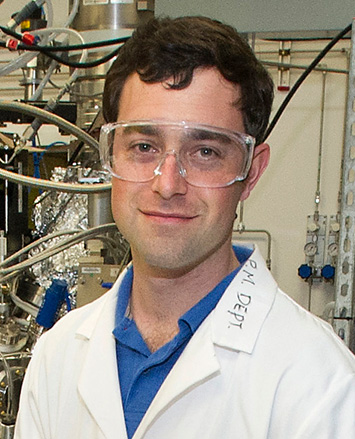 Mark Dean in goggles in front of metal machinery