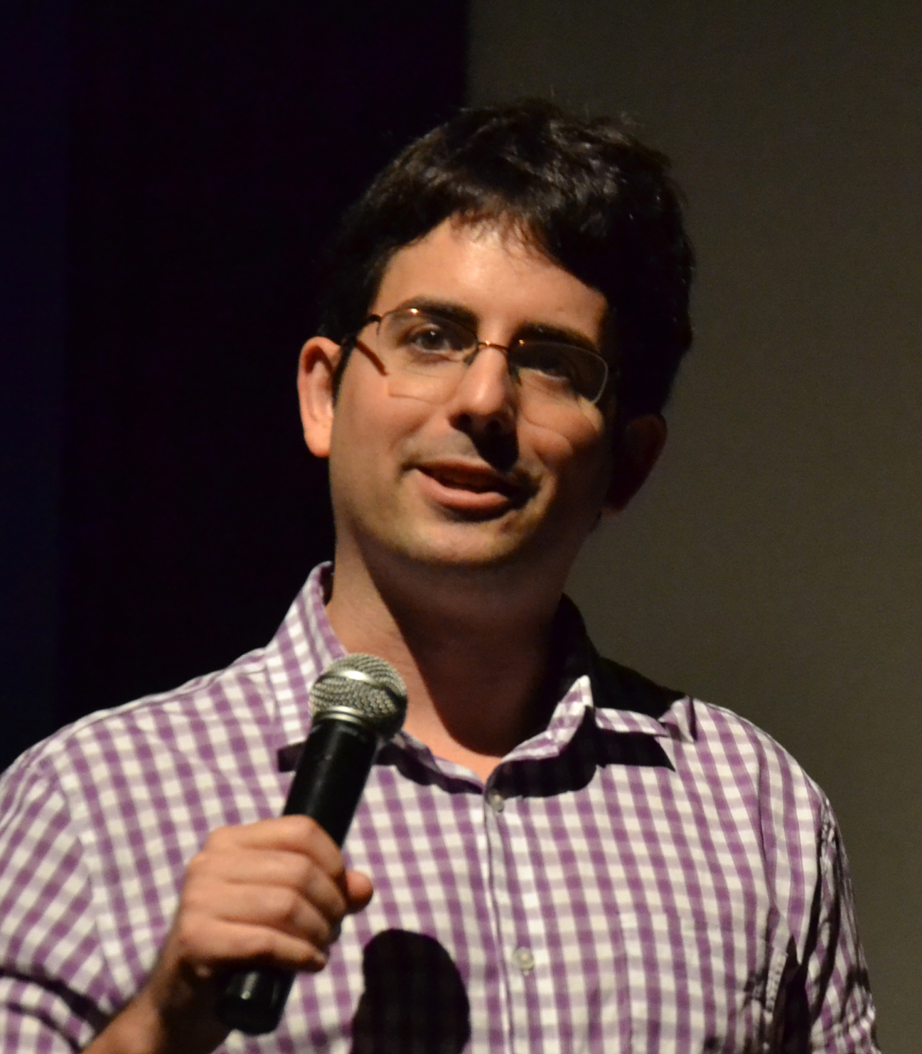 Matt McQuinn speaking into a microphone