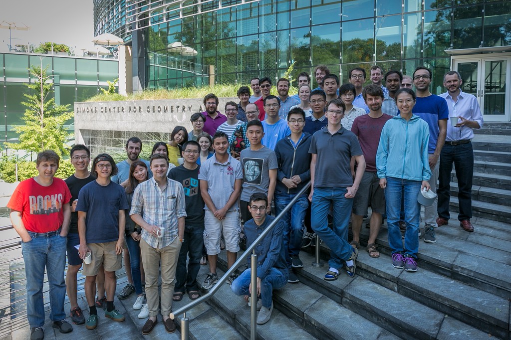 Large group of people posing on stairs of Simons Center for Geometry and Physics