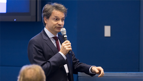 Yuri Tschinkel talking into a microphone