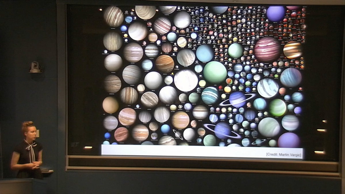 Karin Öberg presenting a slideshow with lots of planets on it