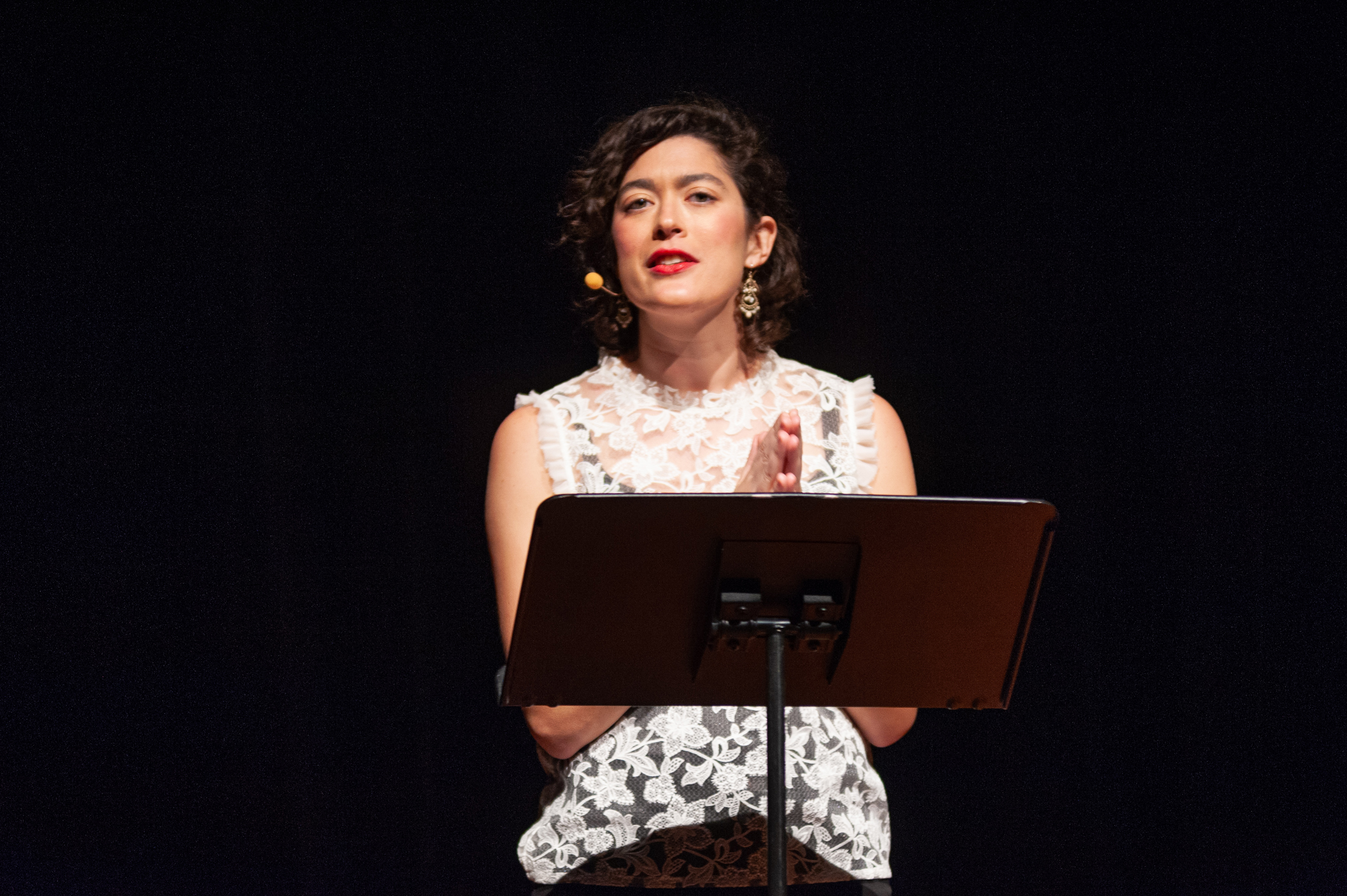Woman standing behind music stand at Radiolab's 