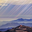 Long-exposure image of star trails (sky motion) above desert inversion layers and Cerro Tololo Inter-American Observatory (a part of AURA) in Chile  Atmospheric refraction plays with the light of any object on the horizon. Here the startrails display immense distortion and mirage as the light rays are refracted and bent in the atmosphere.