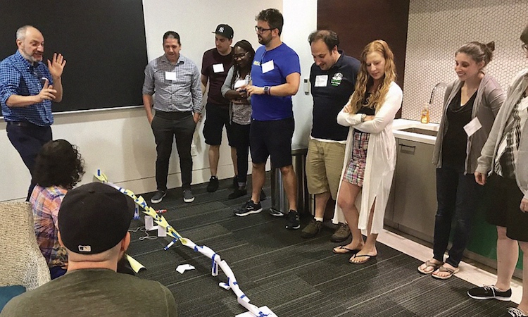Master Teacher Jeffrey Horenstein discusses his group’s paper craft design during a ‘deep dive’ session facilitated by fellow Master Teacher Vielca Anglin
