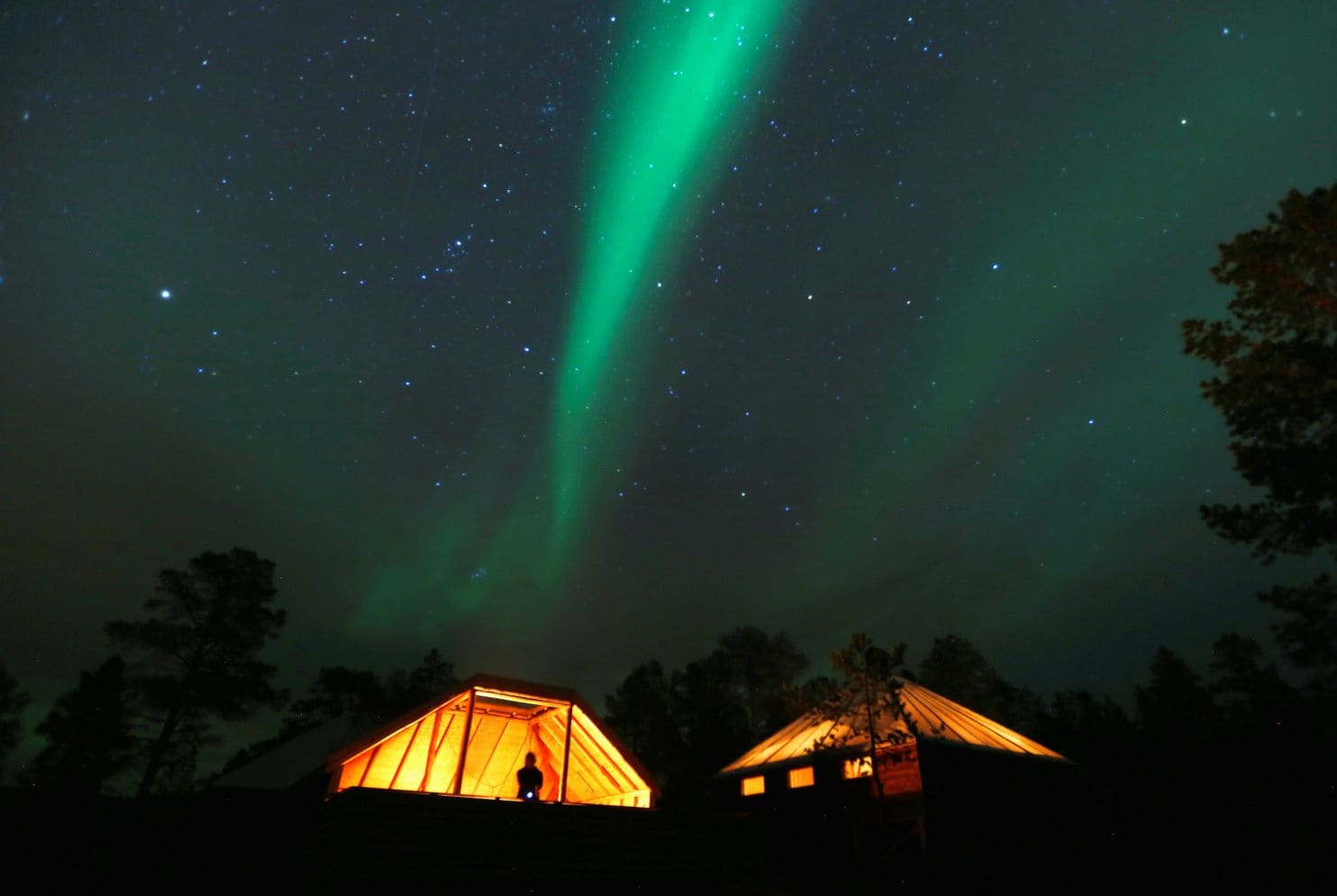 The aurora borealis, seen above the Arctic Circle in Norway, forms when energy particles from the sun interact with the magnetic field of the Earth. Recent observations suggest the field is shifting, sending the magnetic North Pole toward Siberia at a rate of 30 miles a year.