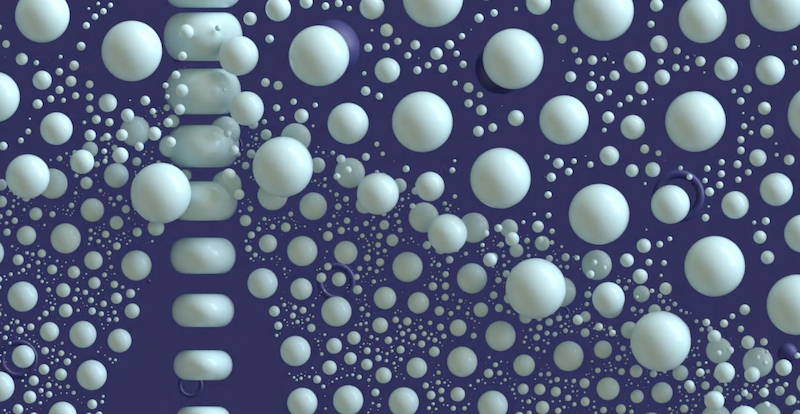 Digital illustration of different sized white spheres floating on a purple background
