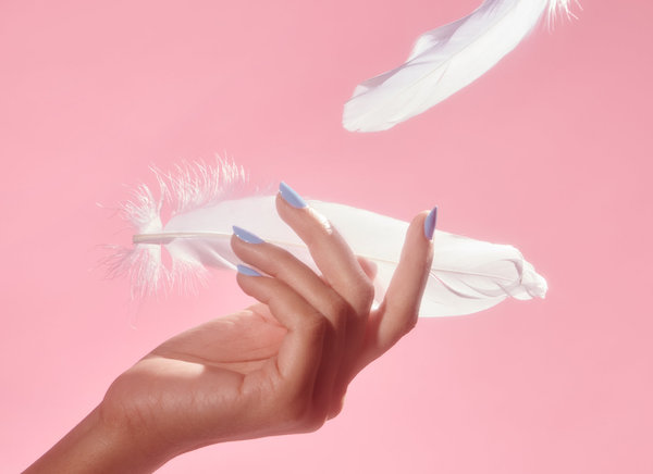 Hand catching feathers