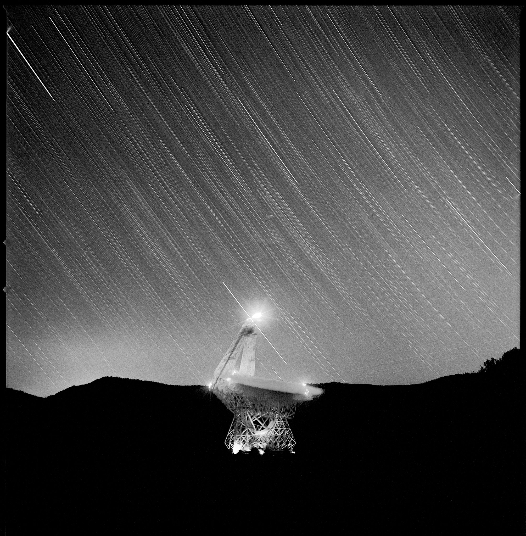 The telescopes at Green Bank are powerful enough to detect the death throes of a star. These photographs were taken on medium format film with a mechanical camera that contained no electronics and required no electricity. To prevent interference, the photographs taken nearest the radio telescopes were made without the aid of a light meter, timer or any device that required a battery.