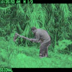 camera trap image showing person digging
