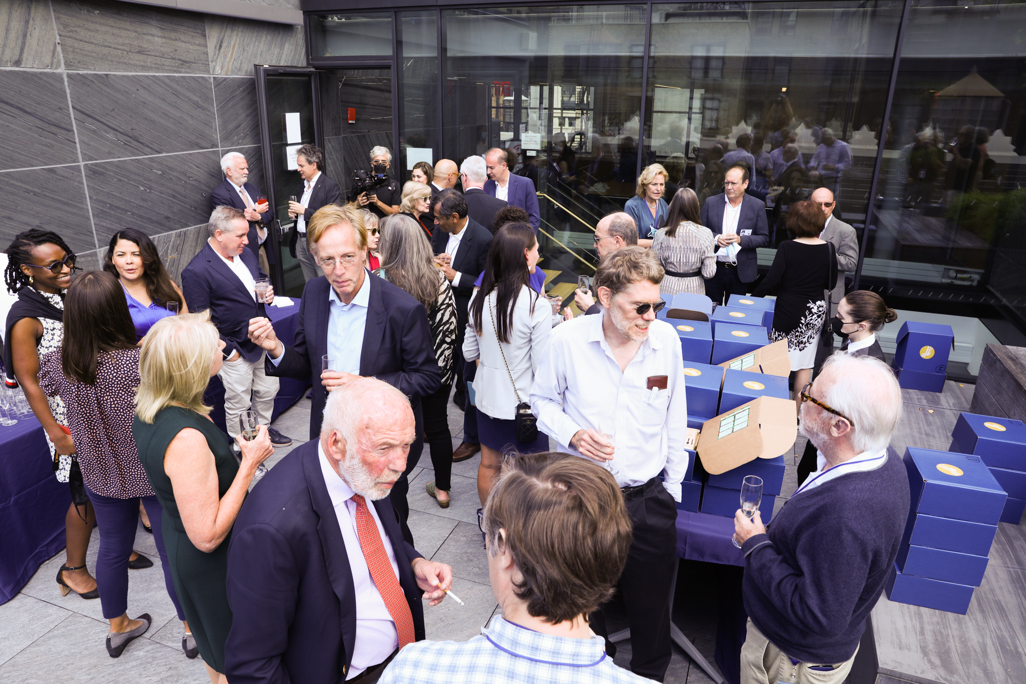 A photograph of a large gathering of people in an outdoor space.