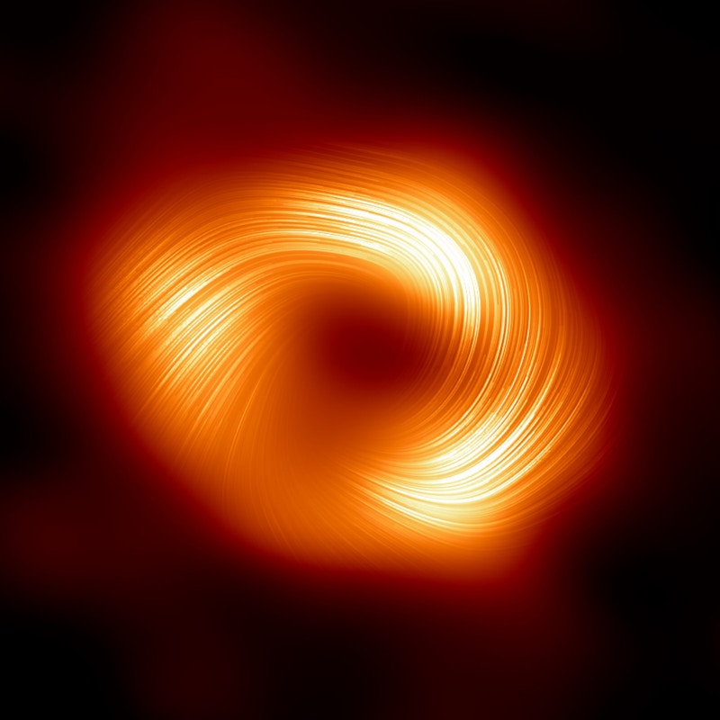 The Event Horizon Telescope (EHT) collaboration, who produced the first ever image of our Milky Way black hole released in 2022, has captured a new view of the massive object at the centre of our Galaxy: how it looks in polarised light. This is the first time astronomers have been able to measure polarisation, a signature of magnetic fields, this close to the edge of Sagittarius A*. This image shows the polarised view of the Milky Way black hole. The lines overlaid on this image mark the orientation of polarisation, which is related to the magnetic field around the shadow of the black hole.