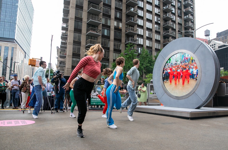 People dancing in front of the Portal in New York City