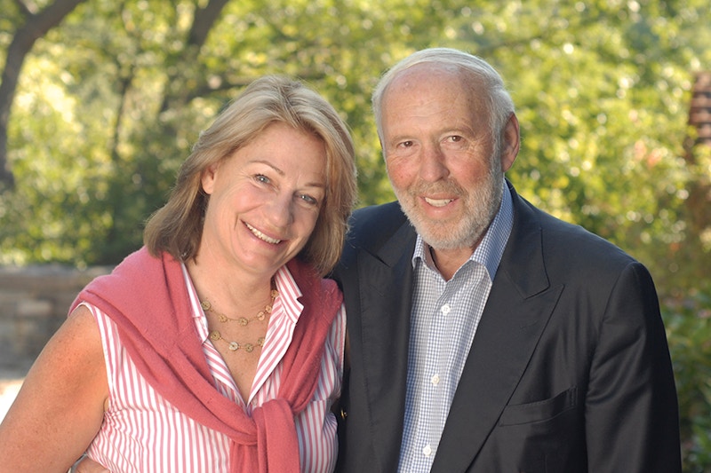 Marilyn and Jim Simons standing in front of trees