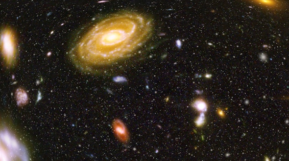 Image displaying stars and galaxies in space.