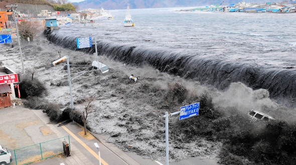 A photo of a large wave approaching Miyako City, Japan, after a magnitude 8.9 earthquake struck the area in Miyako, Japan, March 11, 2011.