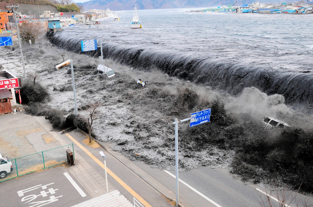 A photo of a large wave approaching Miyako City, Japan, after a magnitude 8.9 earthquake struck the area in Miyako, Japan, March 11, 2011.