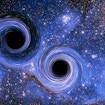 Two black holes in a binary system surrounded by spirals of material.